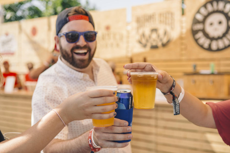 Friends cheers with beer at Windy City Smokeout